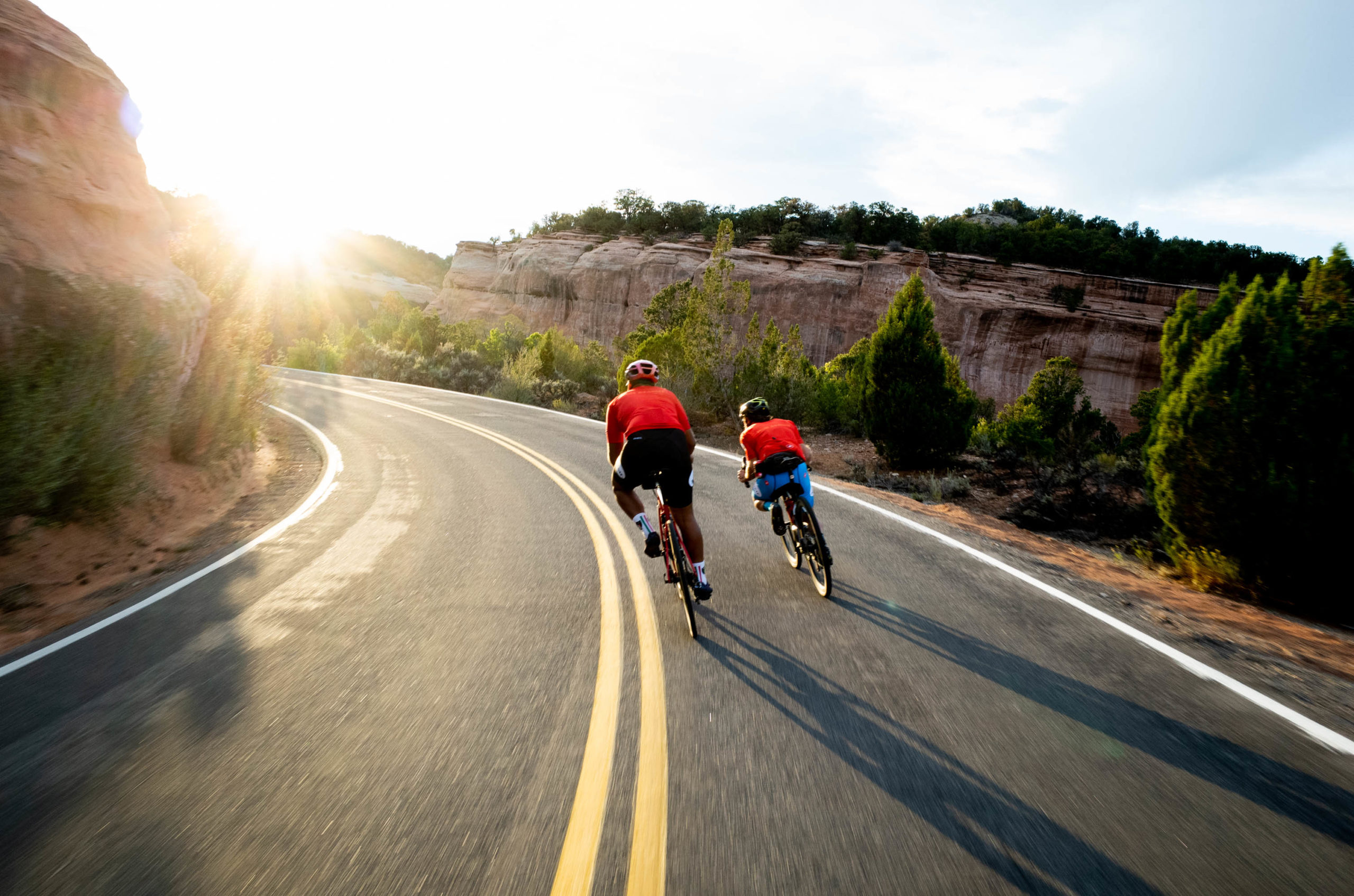 two cyclists riding bikes on mountain