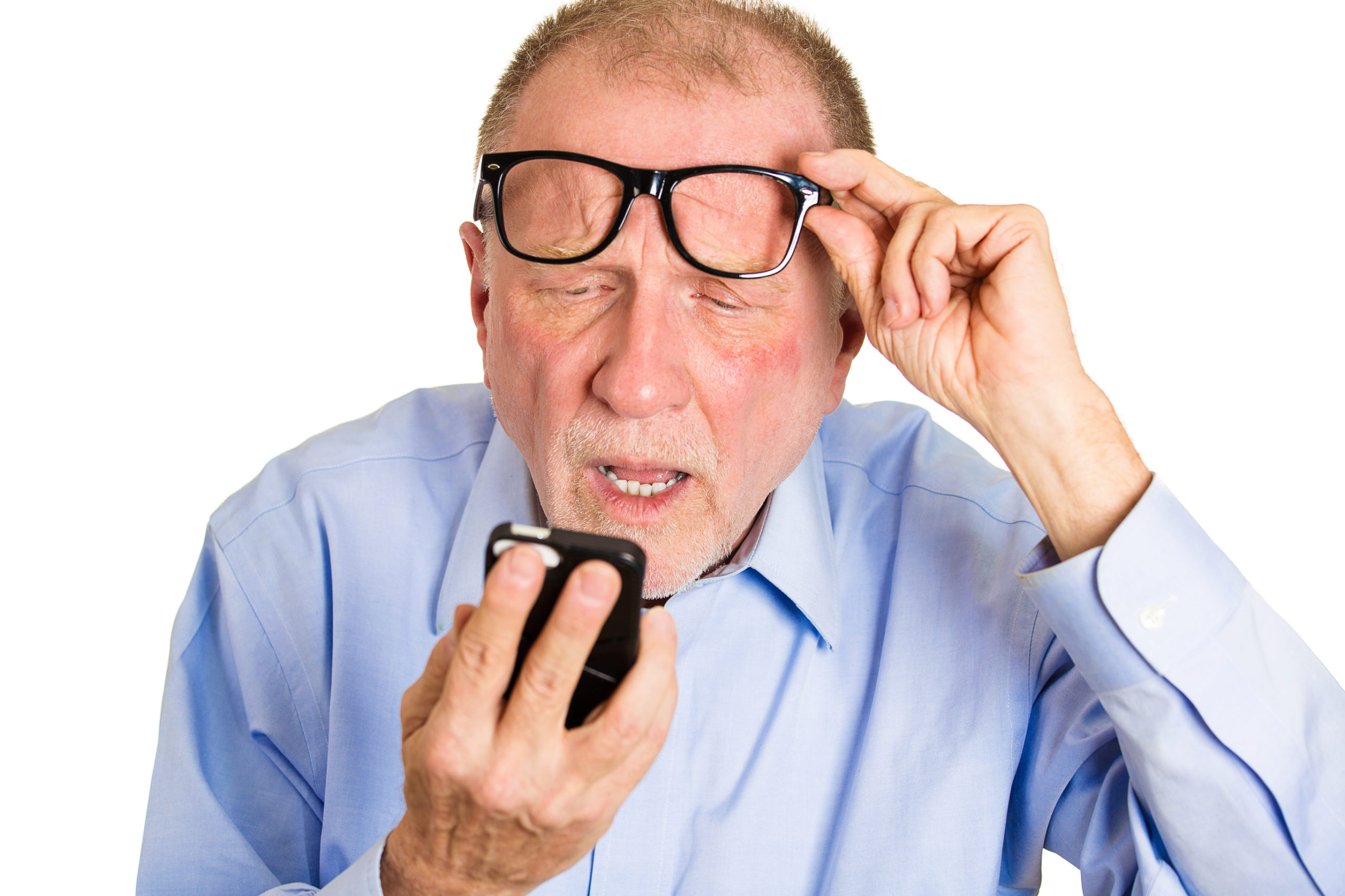 man with macular degeneration squinting at phone