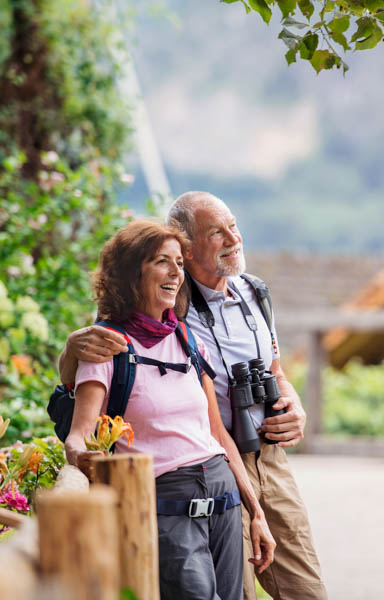 older couple enjoying hiking after cataract surgery in Aspen Colorado